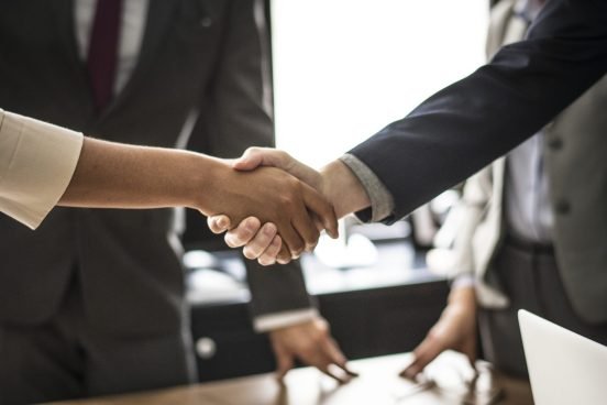 Business people shaking hands in a meeting room